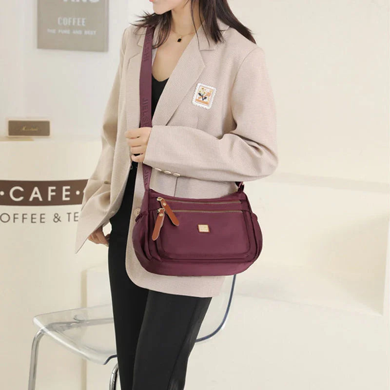Shoulder strap bag with multiple compartments