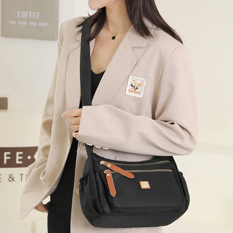 Shoulder strap bag with multiple compartments